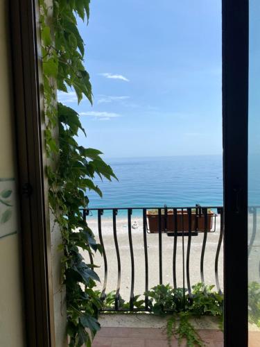 a view of the beach from a window at Hotel San Pietro in Letojanni