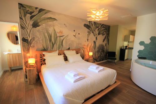 Ένα ή περισσότερα κρεβάτια σε δωμάτιο στο La Maison de l'Olivier