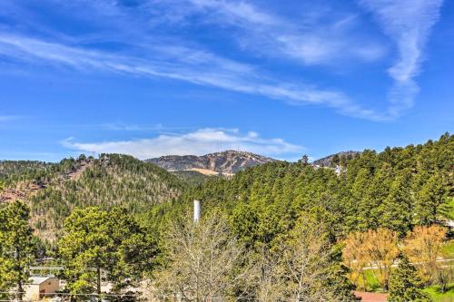 a view of a mountain with trees and a blue sky at Classic Mountain Home, Half Mi to Main Street in Lead