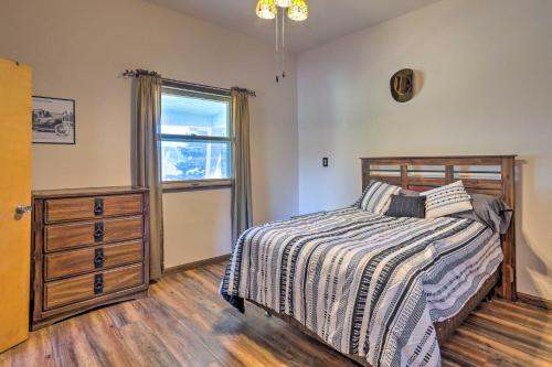 a bedroom with a bed and a dresser and a window at Classic Mountain Home, Half Mi to Main Street in Lead