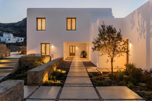 a home with a pathway leading to the front yard at Camarades Mykonos in Ano Mera