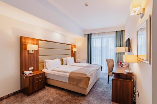 Postel nebo postele na pokoji v ubytování Radsor Hotel