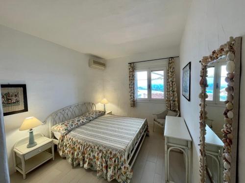 Letto o letti in una camera di SAN TEODORO PUNTA EST STUPENDO TRILOCALE VISTA MARE