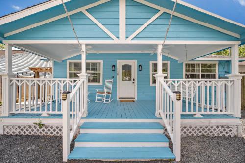 a blue house with a white porch and stairs at Blue Bungalow In Houston Heights! Walkable to Popular Bars in Houston
