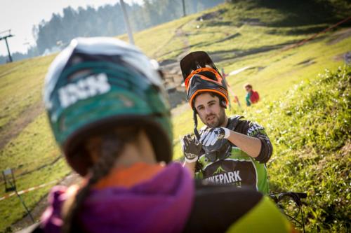 a man is riding a bike on a hill at Haus Amatschon in Brand