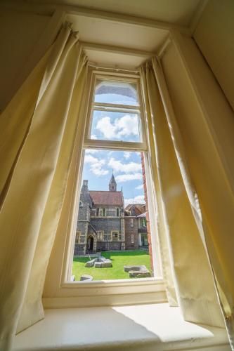 an open window with a view of a building at Sarum College in Salisbury