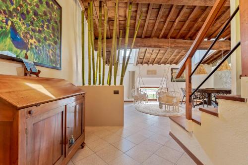 a living room with a staircase and a dining room at Magnolia, Terre Marine in Lerici