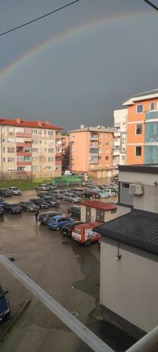 a parking lot with parked cars in a city at Lara in Doboj