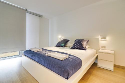 Ένα ή περισσότερα κρεβάτια σε δωμάτιο στο Alse Homes Adeje Plaza