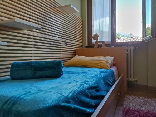 Tempat tidur dalam kamar di Barzio Paradise