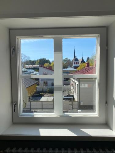a window with a view of a city at Eleonora Bed & Breakfast in Kristiinankaupunki