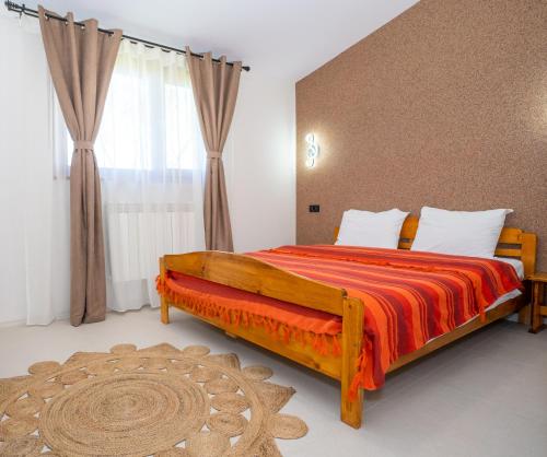 Postel nebo postele na pokoji v ubytování Casa Nikita