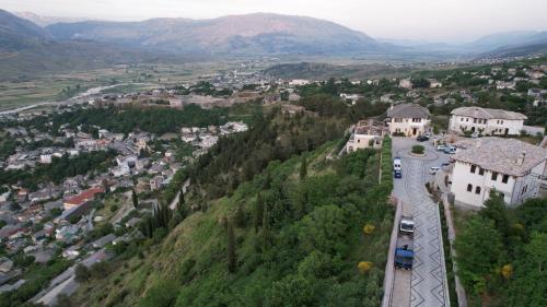 an aerial view of a town in a mountain at KERCULLA Resort in Gjirokastër