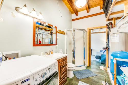 a bathroom with a shower and a sink and a toilet at Deep Water Cabin in Hollywood Beach
