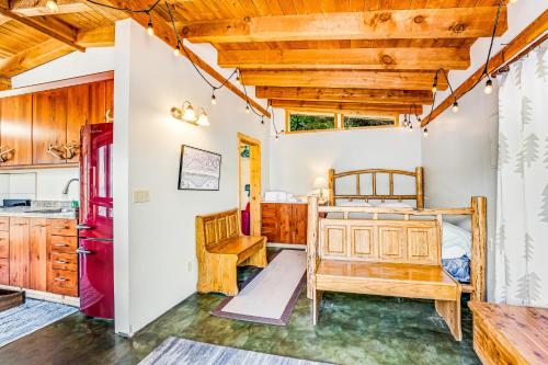 a bedroom with a bed and a kitchen in a house at Deep Water Cabin in Hollywood Beach