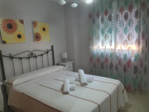 Postel nebo postele na pokoji v ubytování Torrox-Costa Playa