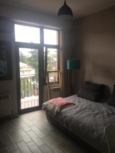 Postel nebo postele na pokoji v ubytování Great view apartment near Piazza Batumi