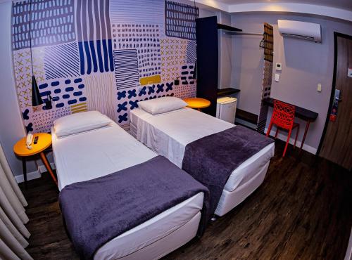 Postel nebo postele na pokoji v ubytování B Hotel Salvador