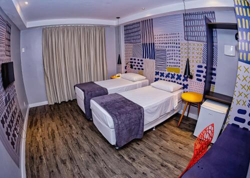 Postel nebo postele na pokoji v ubytování B Hotel Salvador