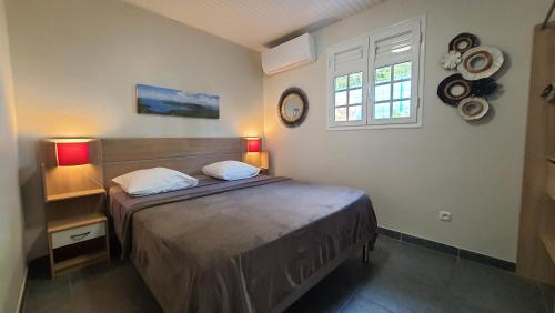 Postel nebo postele na pokoji v ubytování Les Terrasses du Cap
