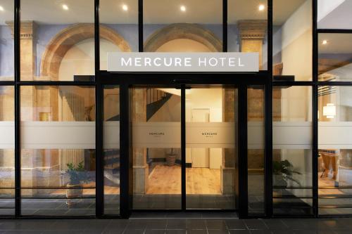 a store front with a sign that reads metroure hotel at Mercure Grand Hôtel Metz Centre Cathédrale in Metz