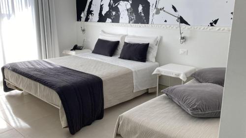 Postel nebo postele na pokoji v ubytování QuiHotel