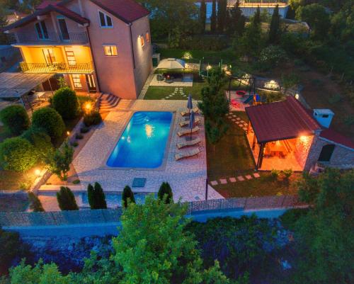 an aerial view of a house with a swimming pool at Villa Prima Natura Imotski, private pool in Imotski