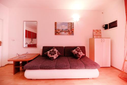 a living room with a couch and a table at Sea View Apartment in Zadar in Zadar