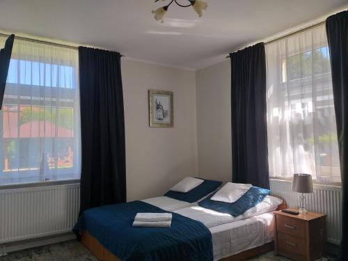 Posteľ alebo postele v izbe v ubytovaní Apartamenty i pokoje gościnne KOŁODZIEJÓWKA