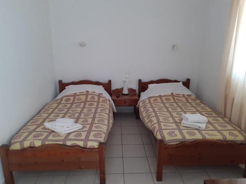 Postel nebo postele na pokoji v ubytování Γαληνη