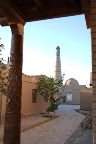 a view of a lighthouse from a building with a pole at Shaherezada Boutique Hotel in Khiva