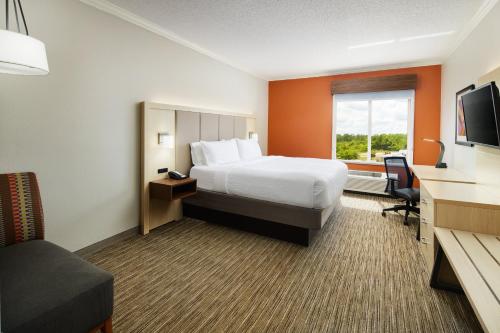 a hotel room with a bed and a window at Holiday Inn Express & Suites Bonifay by IHG in Bonifay