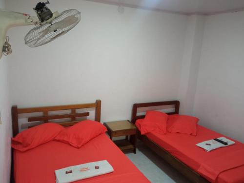 Un pat sau paturi într-o cameră la Hotel Panorama Neiva