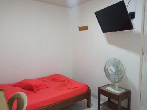 Un pat sau paturi într-o cameră la Hotel Panorama Neiva