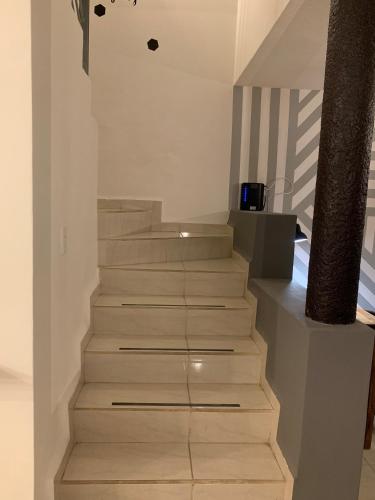 a staircase in a house with white walls at Casa Real San Marcos A en Privada Zona Norte in Irapuato