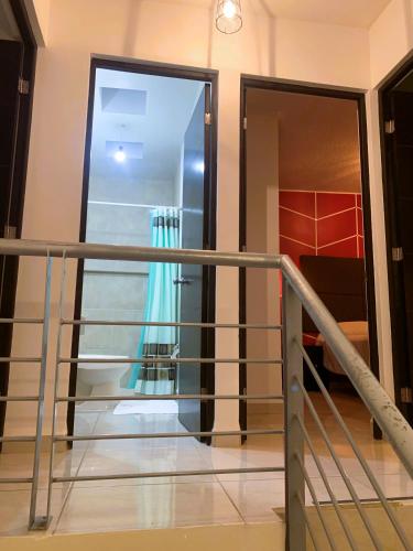 a balcony with a glass door in a building at Casa Real San Marcos A en Privada Zona Norte in Irapuato
