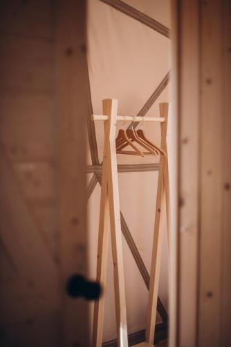 a wooden ladder standing in a room at VasaRojaus Kupolai in Birštonas