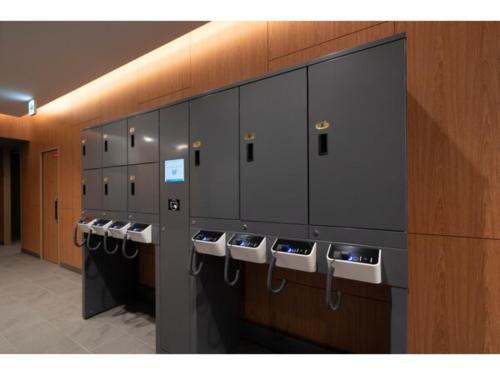 a row of lockers in a public restroom at R&B Hotel Sendai Higashiguchi - Vacation STAY 39922v in Sendai