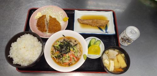 a tray of food with rice and a plate of food at INARIRYOKAN - Vacation STAY 47680v in Sayama