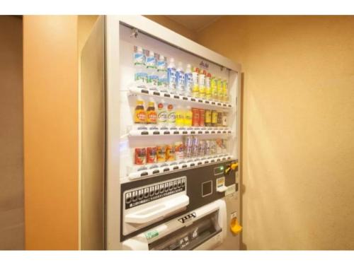 an open refrigerator filled with lots of drinks at R&B Hotel Sendai Hirosedori Ekimae - Vacation STAY 39668v in Sendai