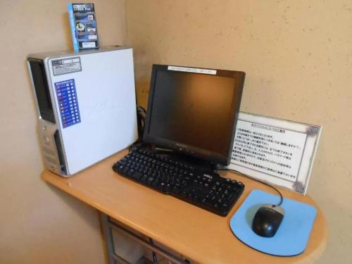 a desk with a laptop computer and a mouse at R&B Hotel Sendai Hirosedori Ekimae - Vacation STAY 39668v in Sendai
