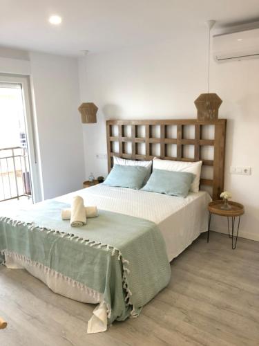 Ένα ή περισσότερα κρεβάτια σε δωμάτιο στο Estudios Peñiscola Ermitana 22