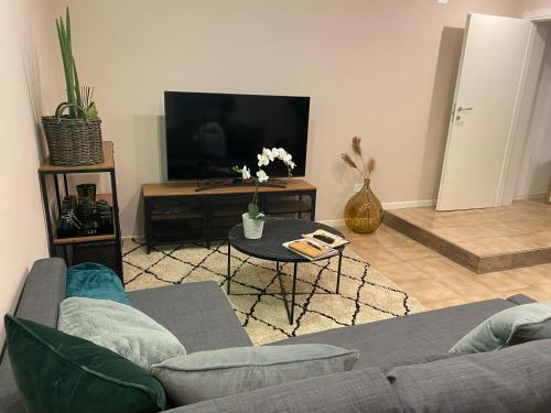 a living room with a couch and a tv at Adream in Pescara