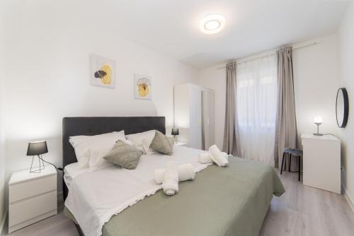 Posteľ alebo postele v izbe v ubytovaní Apartman Porto
