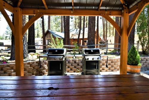 a gazebo with two stoves in a yard at Snow Lake Lodge in Big Bear Lake