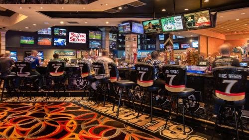 a bar in a casino with people sitting at it at Silver Sevens Hotel & Casino in Las Vegas