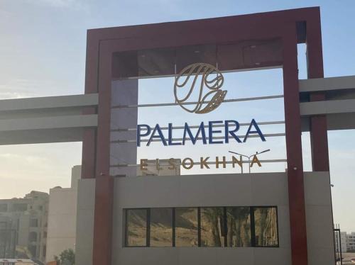 a sign for a palmera pharmaceutical building at Private chalte Palmera sokhna family in Ain Sokhna