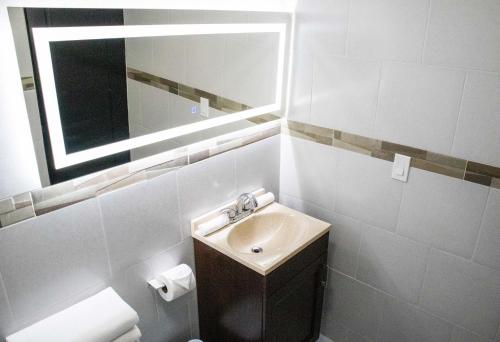 a bathroom with a sink and a mirror at Donjuan By Melida Hotel in Cabo San Lucas