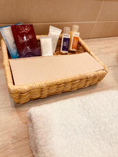 a basket filled with products on a bathroom floor at VILLA CRISTAL in Santa Helena