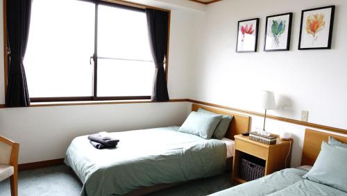 Cama o camas de una habitación en Refre Hotel
